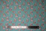 Flat swatch light blue fabric (light blue fabric with white dots allover and tossed coloured dumbo cartoon characters in various poses allover)