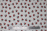 Flat swatch licensed Minnie Mouse fabric in Dreaming in Dots (assorted minnie heads and grey polka dots on white)