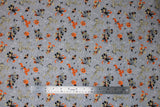 Flat swatch costumed friends fabric (grey fabric with tossed Mickey and Minnie characters in witch and wizard halloween costumes in grey, black, orange colourway, tossed jack-o-lanterns, orange pluto dogs, mumified goofy, etc.)