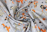 Swirled swatch costumed friends fabric (grey fabric with tossed Mickey and Minnie characters in witch and wizard halloween costumes in grey, black, orange colourway, tossed jack-o-lanterns, orange pluto dogs, mumified goofy, etc.)