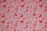 Flat swatch MM Kitchen Magic fabric (pale pink fabric with tossed mickey and minnie mouse cartoon characters allover in chef/baking outfits with tossed food and kitchen tools)