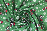 Swirled swatch Festive Mickey fabric (dark green fabric with tossed white snowflakes and mickey mouse characters skating)