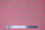 Flat swatch licensed Muppets printed fabric in Miss Piggy (piggy heads on pink)