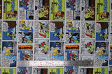 Flat swatch Pinnocchio fabric (Disney's Pinnocchio character comic book style fabric with movie scenes/lines in full colour with green and blue accents)