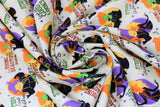 Swirled swatch witchy attitude fabric (off white/pale yellow fabric with small oval badges with witch character silhouettes in purple, yellow, orange, black, green colourway and "to be young and beautiful again" "cursed with good looks" etc. text)