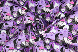 Swirled swatch Diabolical Villians fabric (collaged full colour female villians from Snow White, Little Mermaid and Sleeping Beauty all in black, white and purple tones)