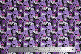 Flat swatch Diabolical Villians fabric (collaged full colour female villians from Snow White, Little Mermaid and Sleeping Beauty all in black, white and purple tones)