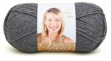A ball of Lion Brand Vanna's Choice yarn on white background in shade charcoal grey