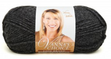 A ball of Lion Brand Vanna's Choice yarn on white background in shade dark grey heather