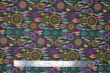 Flat swatch Reve Laura Lancelle fabric (dark grey fabric with tossed full colour illustrative dream catchers allover)