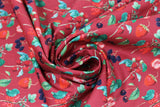 Swirled swatch Griotte Rouge fabric (red fabric with tossed red and black berries and green stems/leaves)