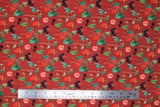 Flat swatch Griotte Rouge fabric (red fabric with tossed red and black berries and green stems/leaves)