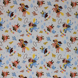 Square swatch Howdy fabric (off white fabric with tossed cartoon cat and dog cowboys on blue horses and hobby horses with tossed cacti in yellow, blue and brown shades and lassos, "Hey Cowboy!" text)