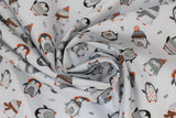 Swirled swatch cozy penguin toss fabric (white fabric with small tossed black and grey cartoon penguins wearing assorted winter wear in grey, orange, forest green colourway with sweater look print within, tiny tossed trees and stars)