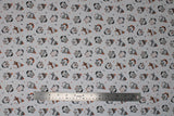 Flat swatch cozy penguin toss fabric (white fabric with small tossed black and grey cartoon penguins wearing assorted winter wear in grey, orange, forest green colourway with sweater look print within, tiny tossed trees and stars)