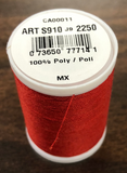 A spool of Coats & Clark Dual Duty All Purpose thread in Red