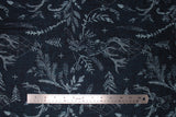 Flat swatch navy stags fabric (navy blue fabric with tossed blue drawing style deer and forest emblems: feathers, leaves/greenery, trees, etc.)