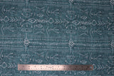 Flat swatch teal stripe fabric (teal distressed look fabric with white drawn style arrows and triangles in stripes allover)