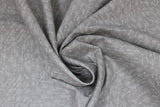 Swirled swatch taupe arrows fabric (pale beige taupe fabric with tiny white arrows allover in various directions)