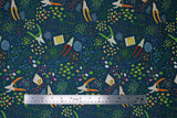 Flat swatch Sow fabric (navy fabric with busy tossed garden tools and outlines and seeds/beans in illustrative style)