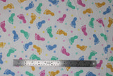 Flat swatch footsteps fabric (white fabric with tossed footprints in blue, green, yellow and pink with gingham pattern, tossed hearts and stars in same colourway no gingham print)