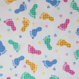 Square swatch footsteps fabric (white fabric with tossed footprints in blue, green, yellow and pink with gingham pattern, tossed hearts and stars in same colourway no gingham print)
