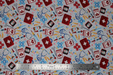 Flat swatch docs gadgets fabric (off white fabric with tossed full colour medical emblems: red first aid kits, black x-rays, white charts, coloured pills, blue stethoscopes, etc.)