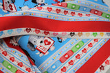 Raw hem swatch happy helpers 2 fabric (thick blue stripes with cartoon dogs and medical equipment, thick red stripe with cartoon cats and mice with medical equipment, separated by white striped with hearts/beat lines, coloured band-aids, etc.)