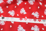 Raw hem swatch miss mousey fabric (red/dark red marbled look fabric with tossed white hearts and grey cartoon mice with pink gingham ears and white nurses hats)