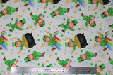 Flat swatch St. Patrick's Day themed fabric in end of rainbow leprechauns and pots of gold on white