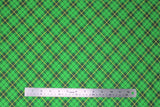 Flat swatch St. Patrick's Day themed fabric in green plaid (green/black/yellow)