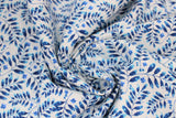 Swirled swatch blue floral printed fabric in blue leaves on white