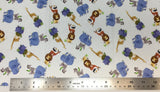 Flat swatch cartoon safari animals printed fabric in white (white fabric with small tossed cartoon stacked animals in full colour: toucan on gazelle on lion, parrot on zebra on elephant, and giraffe on turtle on hippo)