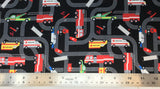 Flat swatch cartoon emergency vehicles on road fabric in black (black fabric with dark grey road lines going all directions and full colour cartoon emergency vehicles on roads)