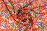Swirled swatch expressions toss fabric (red fabric with deconstructed mr. potato head parts tossed allover making various faces)
