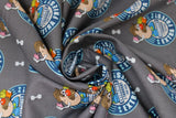 Swirled swatch french fries fabric (grey fabric with small circular badges reading "extra fries!" and showing mr. potato head holding a small carton of fries)