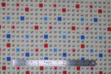Flat swatch Scrabble board fabric (white fabric with Scrabble board layout, tiles, etc. showing alphabet letters and word/letter score squares)