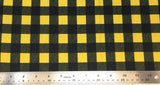 Flat swatch buffalo plaid fabric in yellow/black