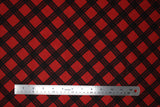 Flat swatch of red and black diamond plaid