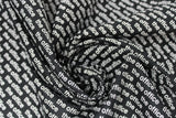 Swirled swatch The Office licensed printed fabric ("the office" text logo white on black)