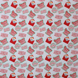 Square swatch santa claus is comin' to town fabric (white fabric with red "Santa Claus is Comin' to Town!" text in red with green outline, red envelopes with "Dear Santa" letter poking out, various red post markings)