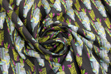 Swirled swatch No Roads fabric (black fabric with future cars allover in grey colours with purple accents and yellow speed lines)