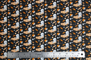 Square swatch Casper fabric (black fabric with tossed white Casper characters and tossed orange and white halloween candy with "Trick or Treat" text)