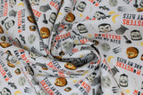 Swirled swatch monster bff fabric (white fabric with small lines of halloween elements: yellow crescent moon, black bat, grey tombstone, grey hammer, werewolf look scratches, Frankenstein heads, mummy heads, werewolf heads, "Monsters are my BFFS" text)