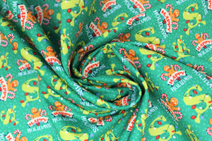 Square swatch dear santa fabric (green fabric with Shrek style "S" with christmas lights wrapped around top, "Happy Holidays" text with gingerbread man holding candy canes)