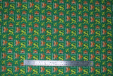 Flat swatch dear santa fabric (green fabric with Shrek style "S" with christmas lights wrapped around top, "Happy Holidays" text with gingerbread man holding candy canes)