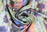 Swirled swatch green fabric (outdoor scenery buffalos at watering hole and lounging in grass collage)