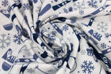 Swirled swatch snow sports fabric in blue (white fabric with tossed snow sports emblems in blue colour: skis, snowboards, goggles, hats, snowflakes, poles, boots)