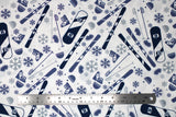 Flat swatch snow sports fabric in blue (white fabric with tossed snow sports emblems in blue colour: skis, snowboards, goggles, hats, snowflakes, poles, boots)