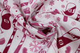 Swirled swatch snow sports fabric in pink (white fabric with tossed snow sports emblems in pink colour: skis, snowboards, goggles, hats, snowflakes, poles, boots)